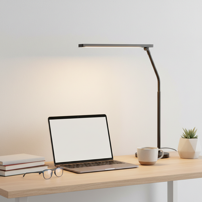 LED desk lamp on study table with books and laptop